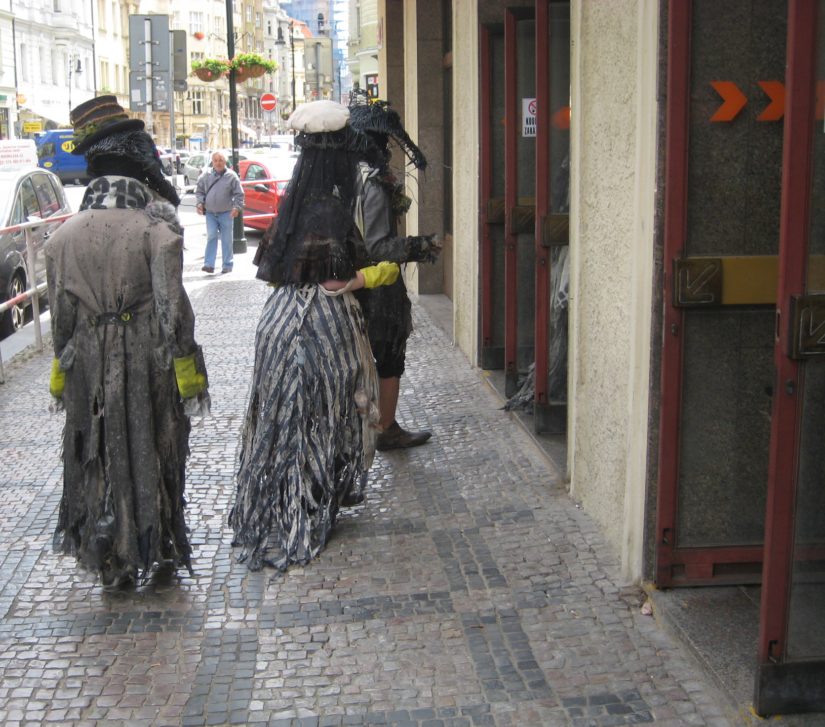 They scurried past the Charles Bridge, down many winding streets, and made their way to the subway.